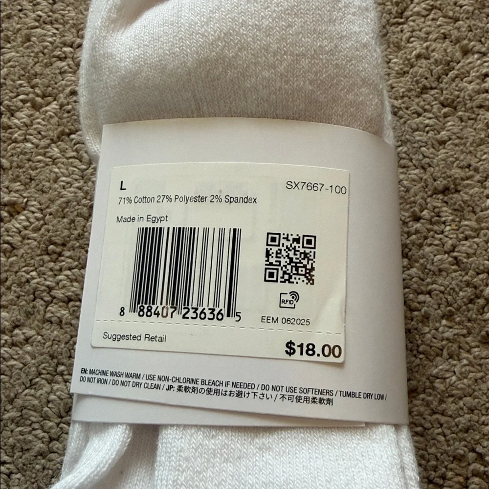 Nike DRI FIT Everyday White Crew Socks with Black Logo.
